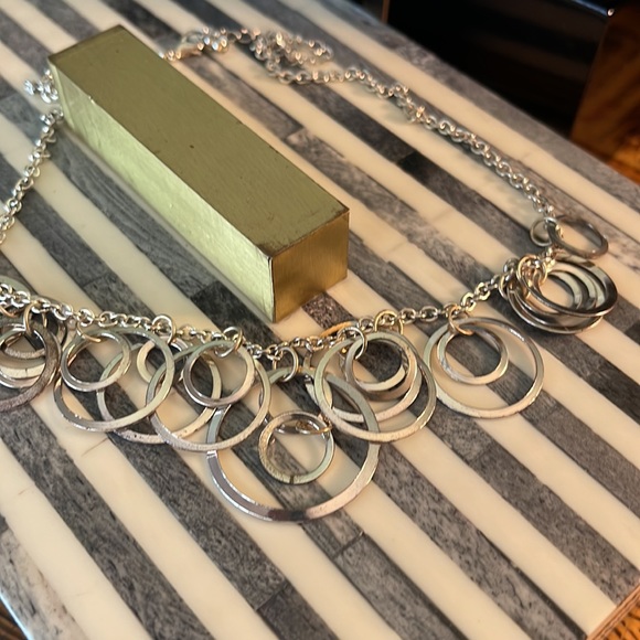 Light silver toned necklace with a variety of circles suspended on silver chain - Picture 12 of 13